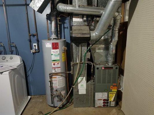 Typical utility room showing furnace and water heater.