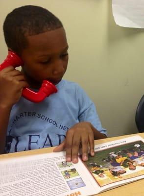 Using a whisper phone to practice fluency in independent reading.