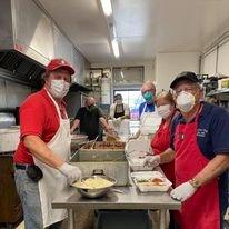 Making drive-thru dinners during the Covid days.