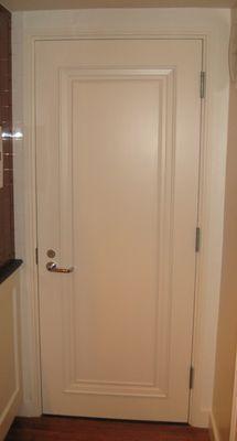 Wood fire-rated door with moldings