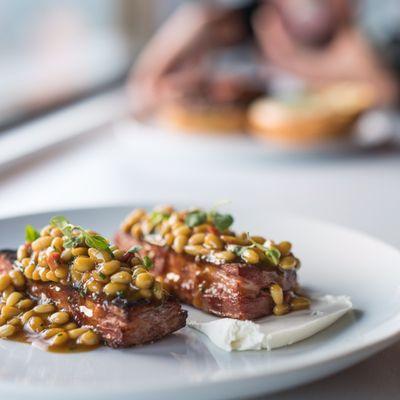 Lamb belly, pine nut cassoulet, yogurt curds