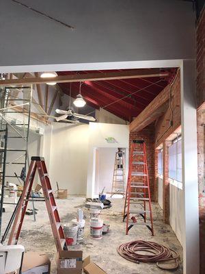 Combining the old and the new...1950s brick warehouse with bow truss ceiling being converted into creative arts studios for rent