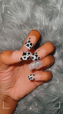 Cow print acrylic nails with bling