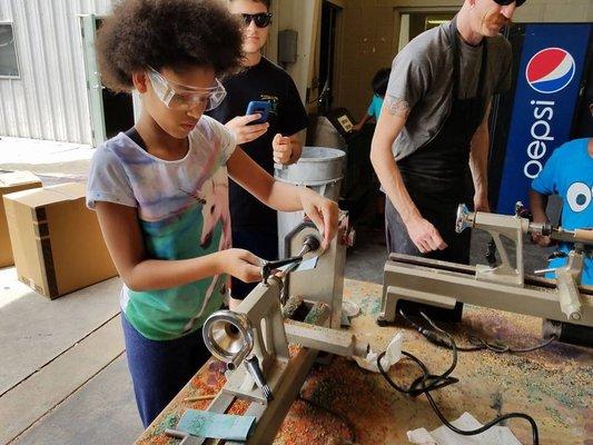 Teaching woodworking skills at the Police Athletic League.