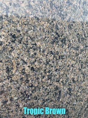 Tropic Brown is a light brown granite with black, cream, and grey colors all throughout.