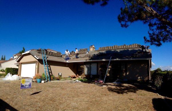 Day 2 - adding tapered perlite panels on the edge, new pipes, vents, flashings and relaying original usable tiles.