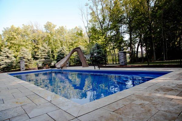 Fiberglass Pool with Travertine Decking