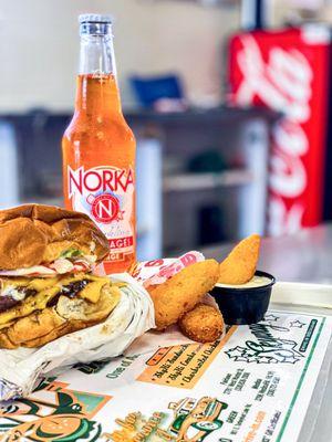 Quarter pound cheeseburger, potato teasers and Norka craft soda