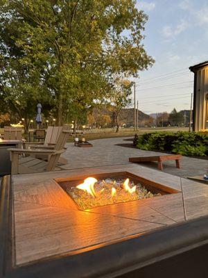 Outdoor patio with gas fire and corn hole