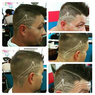 Light fade with freestyle line design done by barber apprentice, Cynthia