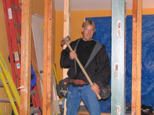 Here's one of the carpenters preparing to make toothpicks of the existing framing.