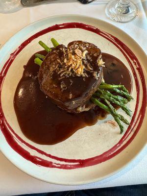 The filet mignon. On a baked potato, smashed out, with sprigs of asparagus.