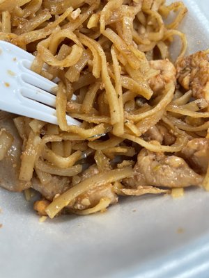 Pad Thai with a piece of metal in it.