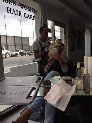 Here I sit getting my hair touched up by the best hairstylist Carlos!