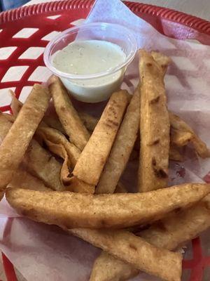 Fried tortilla with creamy cilantro dip