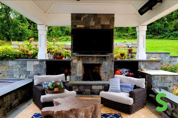 TV Mounted up under a covered patio to create a nice entertainment space for perfect weather days.