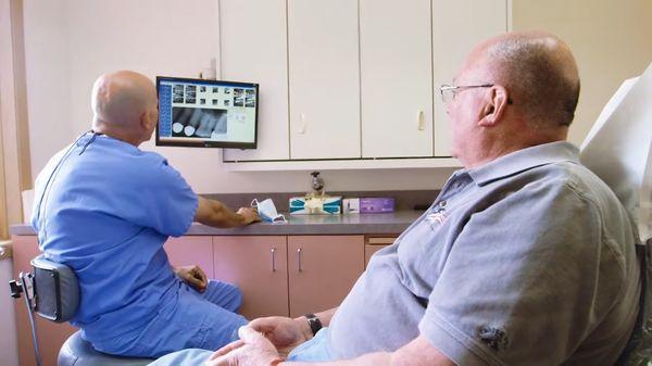 Spokane Valley dentist Dr. Craig Ellsworth explaining dentures procedure to patient at Family Dental of Spokane Valley