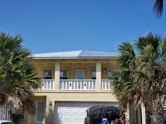 South Padre Island, Texas installing a metal roof.