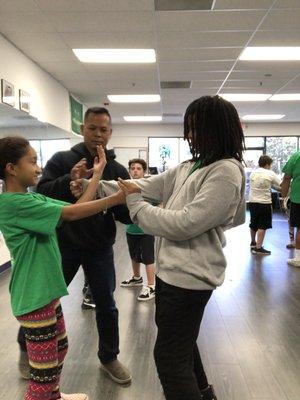 Working the block and punch in the youth Wing Chun class.