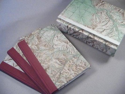 Boxed set of 3 handmade blank journals made using upcycled topographic maps.