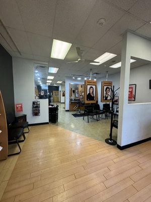 Inside of the store with some of the waiting and hair cut areas