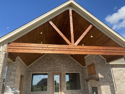 In this Porch the b board and cedar beams were stained with a nice color to complement the exterior brick walls