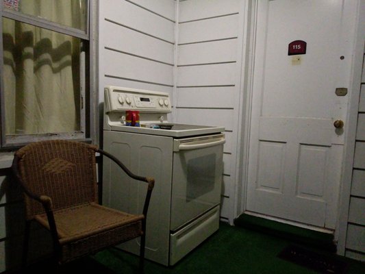 A nonfunctional stove on the porch.