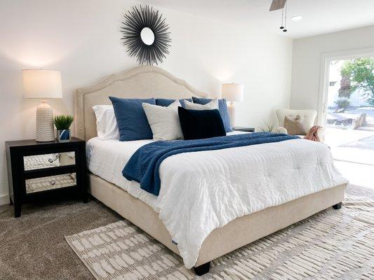 Bedroom with blue and white bedding