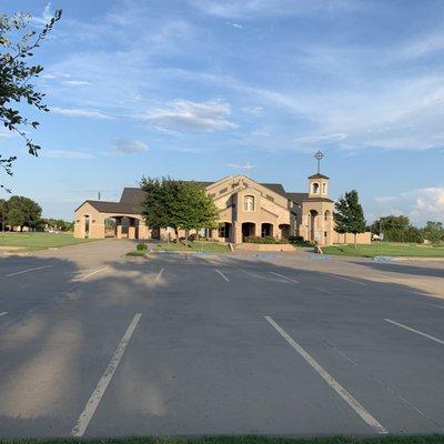 Front of Our Lady Queen of Peace Catholic Church with ample parking.