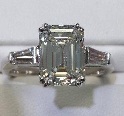 3 stone Emerald cut engagement ring