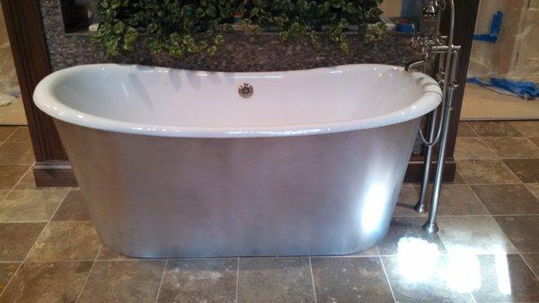 Free standing new tub as part of a bathroom remodel.