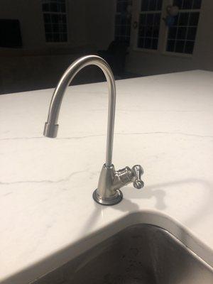 Reverse osmosis system faucet near the kitchen sink