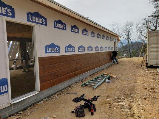 Wood siding, door installation