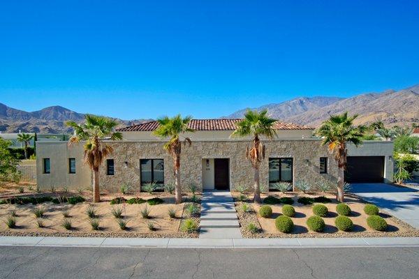 A Palm Springs remodel including updated softscape/hardscape, installed fire feature and putting green.