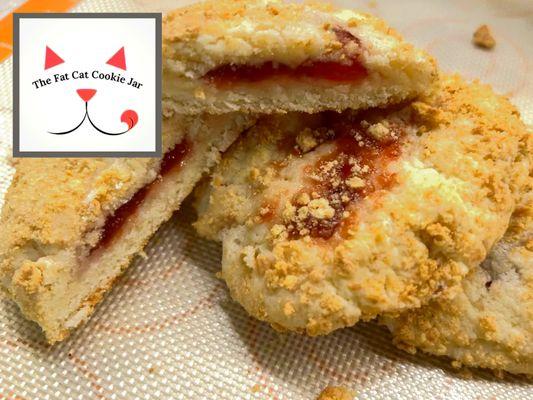 Strawberry Cheesecake Cookies! A big, soft style cookie that is thick and rich with real cream cheese, filled with strawberry and rolled in