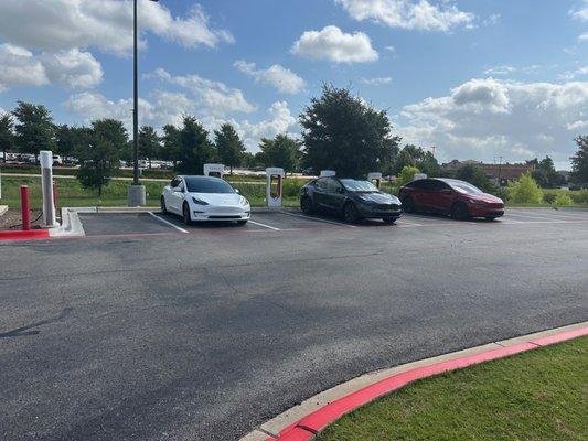 Teslas hanging at the Super Charger