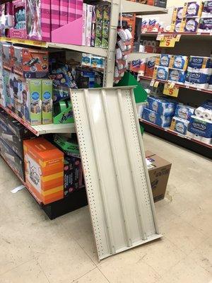 Elderly customers almost fell over this metal shelf that was left in the middle of the aisle.