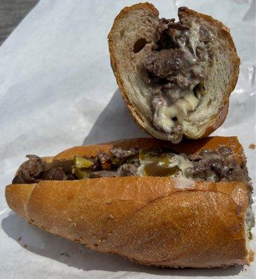 12" "Delco Classic" sized cheesesteak on a Carangi seeded roll with hot peppers and Cooper sharp cheese