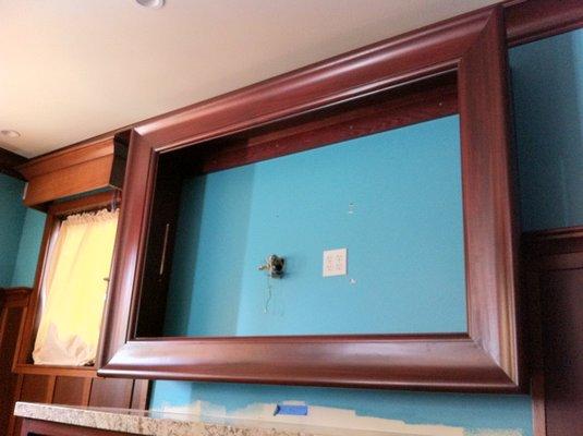 Custom made TV frame built in made from solid original mahogany.