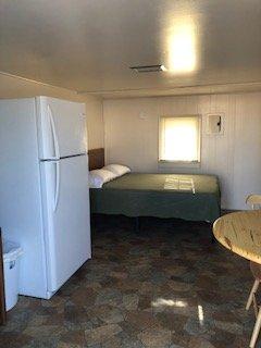 Our cabins have a private bathroom, refrigerator microwave & small table.