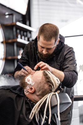 Brandon, one of our talented barbers at Earleigh Heights Social Barber Company. For the ultimate experience 
try our crafted beard service.