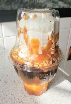 Carmel hot fudge sundae with nuts