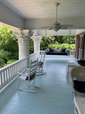 Gotta love Corinthian columns, a porch swing, and a nice view from the second floor balcony!!