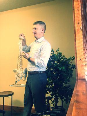 Dr. Berrett educating patients about the importance of a healthy spine.