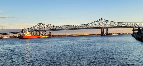 A Barge going under a Mississippi River Bridge