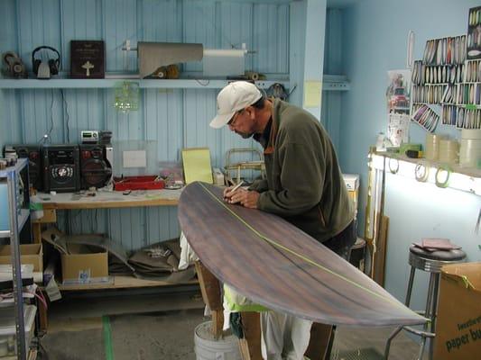 Al Merrick signing special Redwood board for his son Britt.