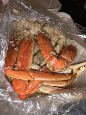 Crab legs with spicy seasoning and garlic and lots of butter