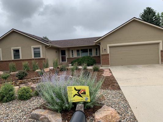 We helped give this home a facelift with stucco and a new roof.