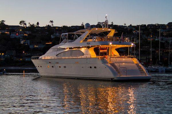 Yacht at dusk with lights on