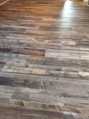 Large format "wood look" porcelain floor in a family room